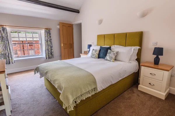 King Size Bed in Bedroom - Clock Tower Apartment