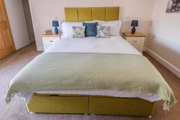 Bed in Bedroom - Clock Tower Apartment