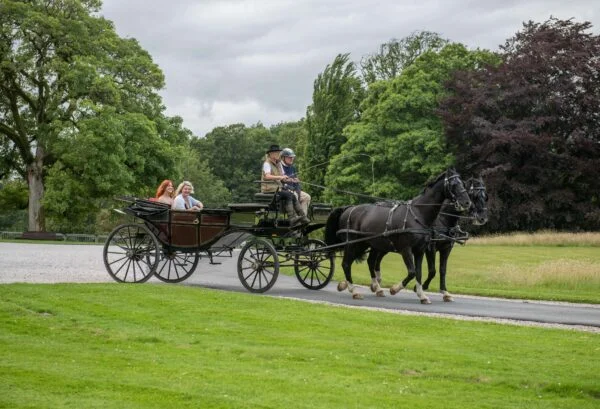 Netherby Hall's experience breaks including carriage rides through its grounds