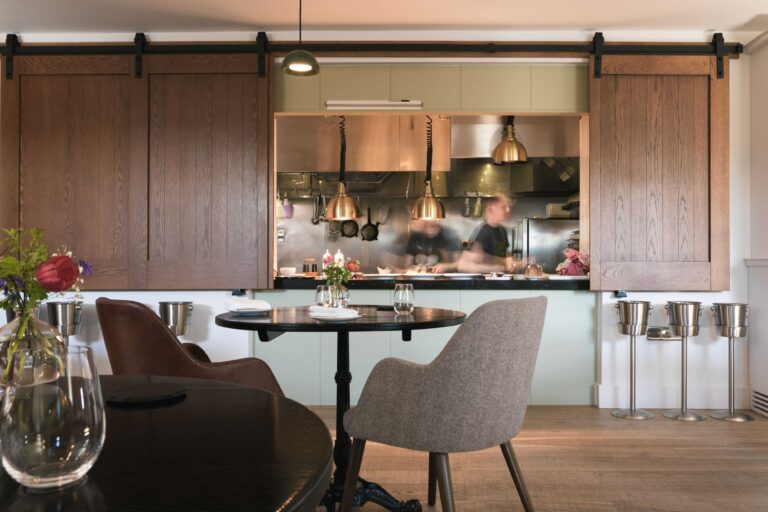 The dining room at Pentonbridge Inn with view of the kitchen pass