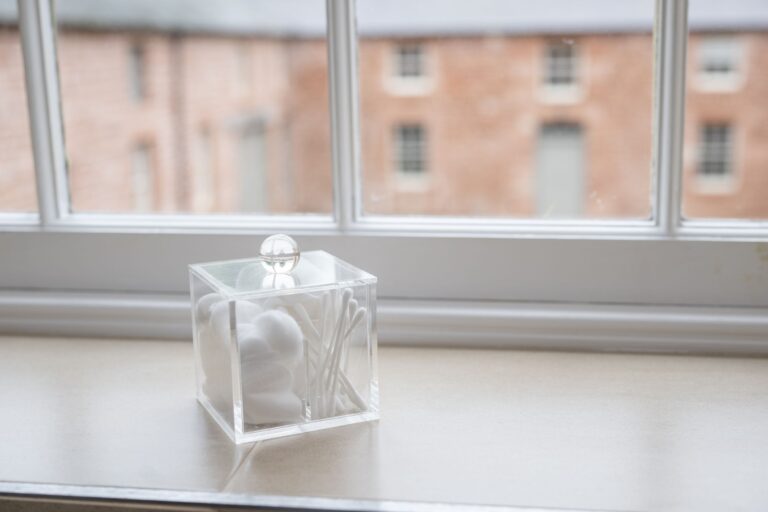 View from a window of the Clock Tower Apartment looking out onto the historic stone buildings at Netherby Hall Estate