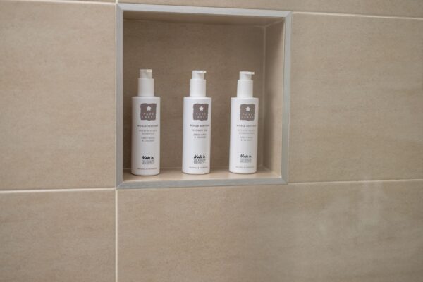 Luxury toiletries provided in the bathroom of the Clock Tower Apartment at Netherby Hall, Cumbria