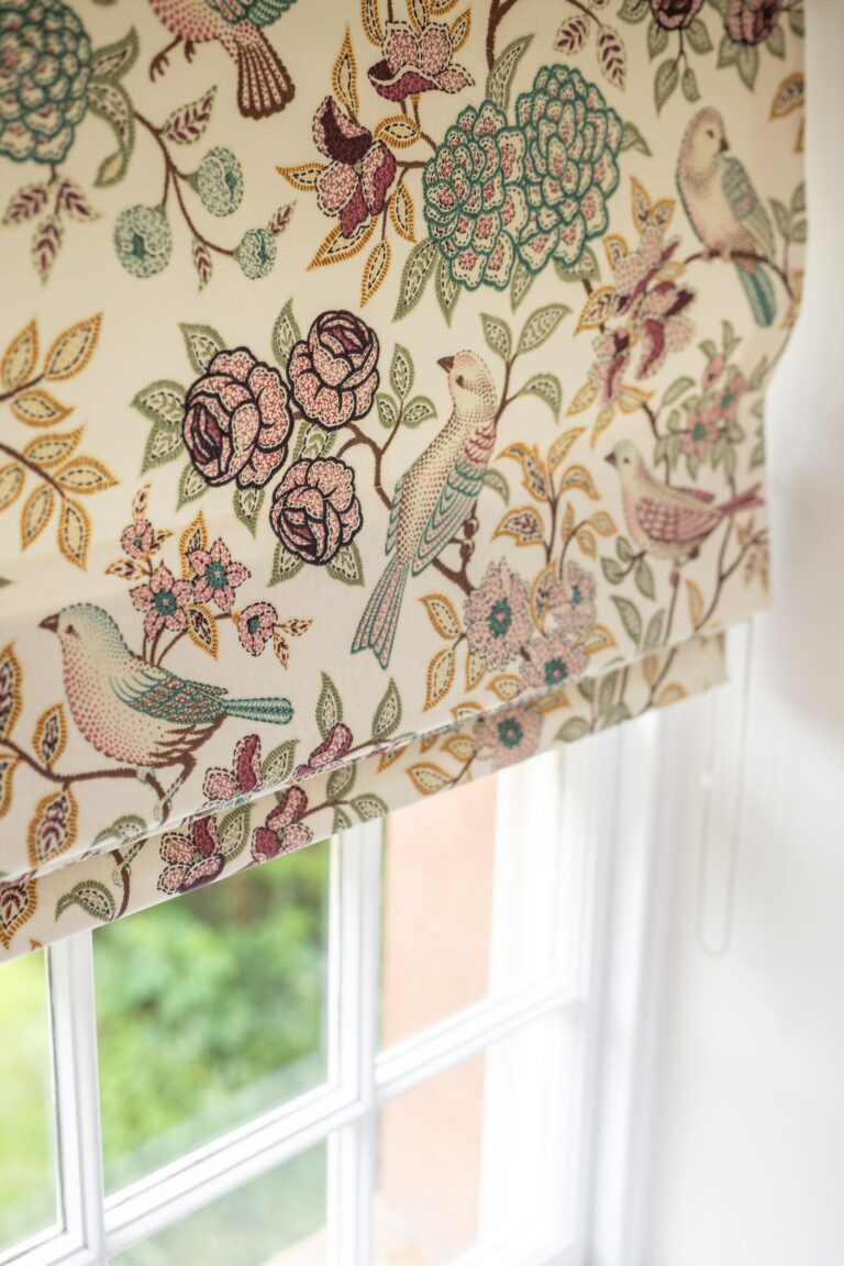 Floral bird print roman blind in the Clock Tower Apartment, luxury self-catering accommodation at Netherby Hall, Cumbria