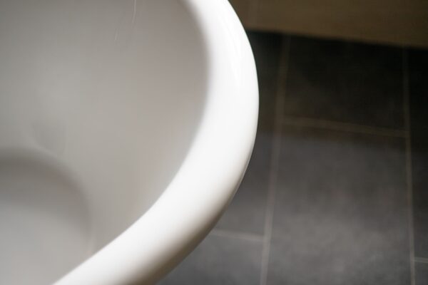 Close-up view of the modern white sink in the Salutation Apartment at Netherby Hall